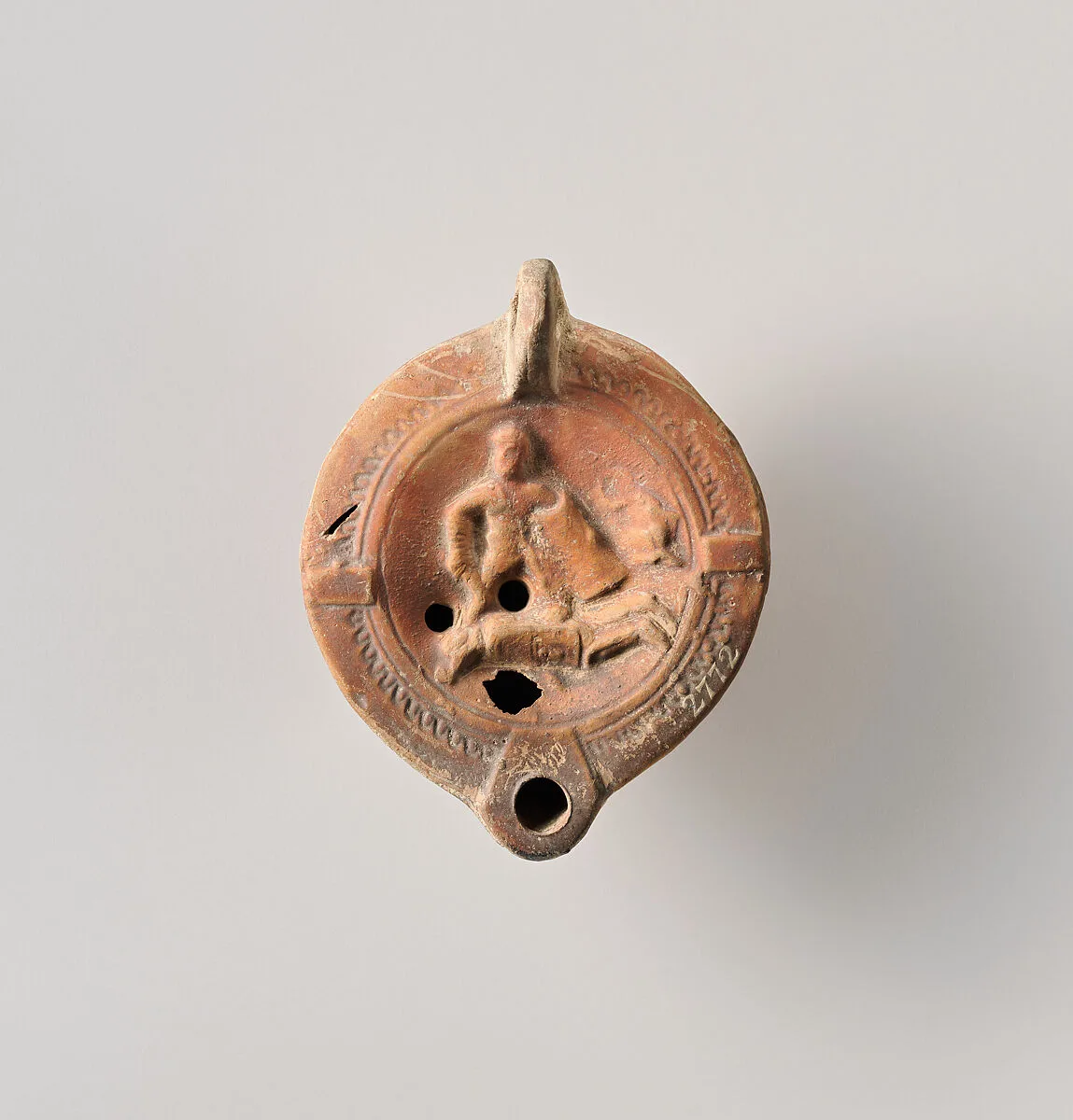 Terracotta oil lamp — Unknown