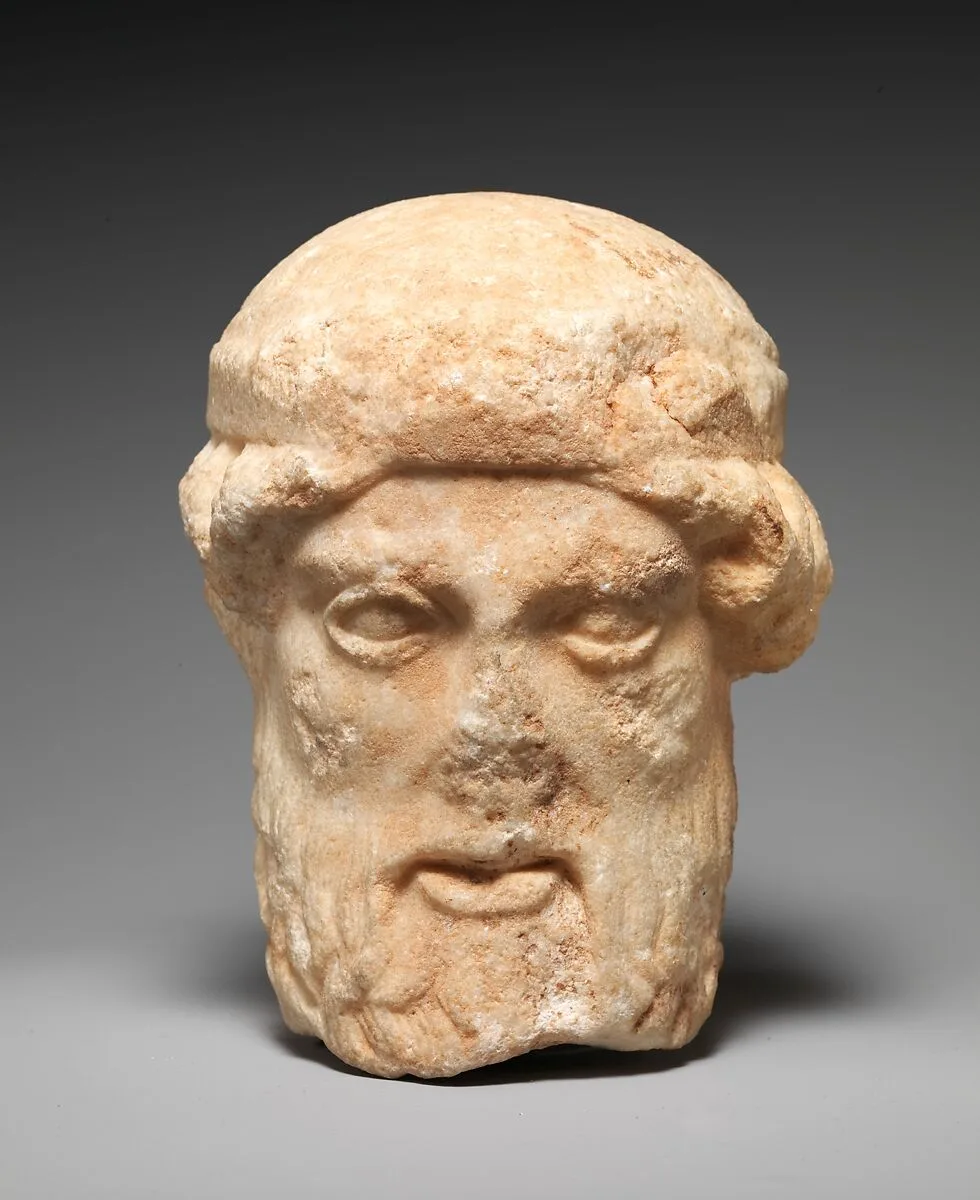 Marble herm head of a bearded deity — Unknown