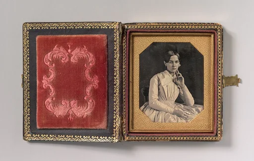 [Seated Young Woman with Hand Raised to Jawline]