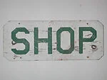 [Stenciled Sign: "Shop"]