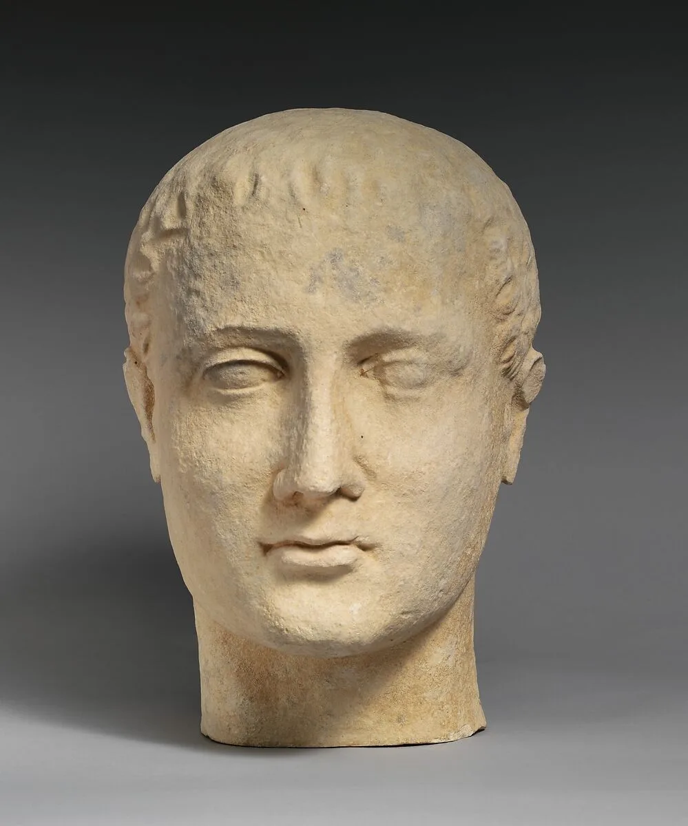 Limestone head of a beardless male votary — Unknown