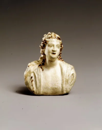 Faience appliqué with a bust of Dionysos