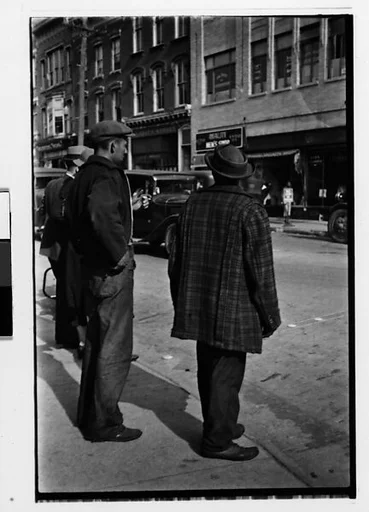 [Two 35mm Film Frames: Two Men Crossing Street, From Behind]