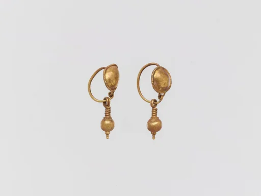 Pair of gold earrings with disc and pendant