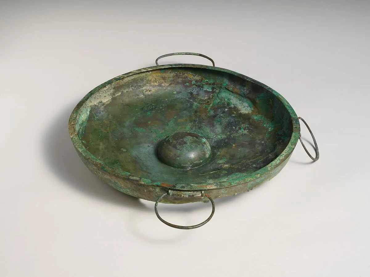 Two bronze swinging handles, perhaps from phialai (libation bowls) — Unknown