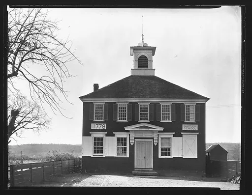 [Bullet Hill Schoolhouse with Placard "1778" on Façade]