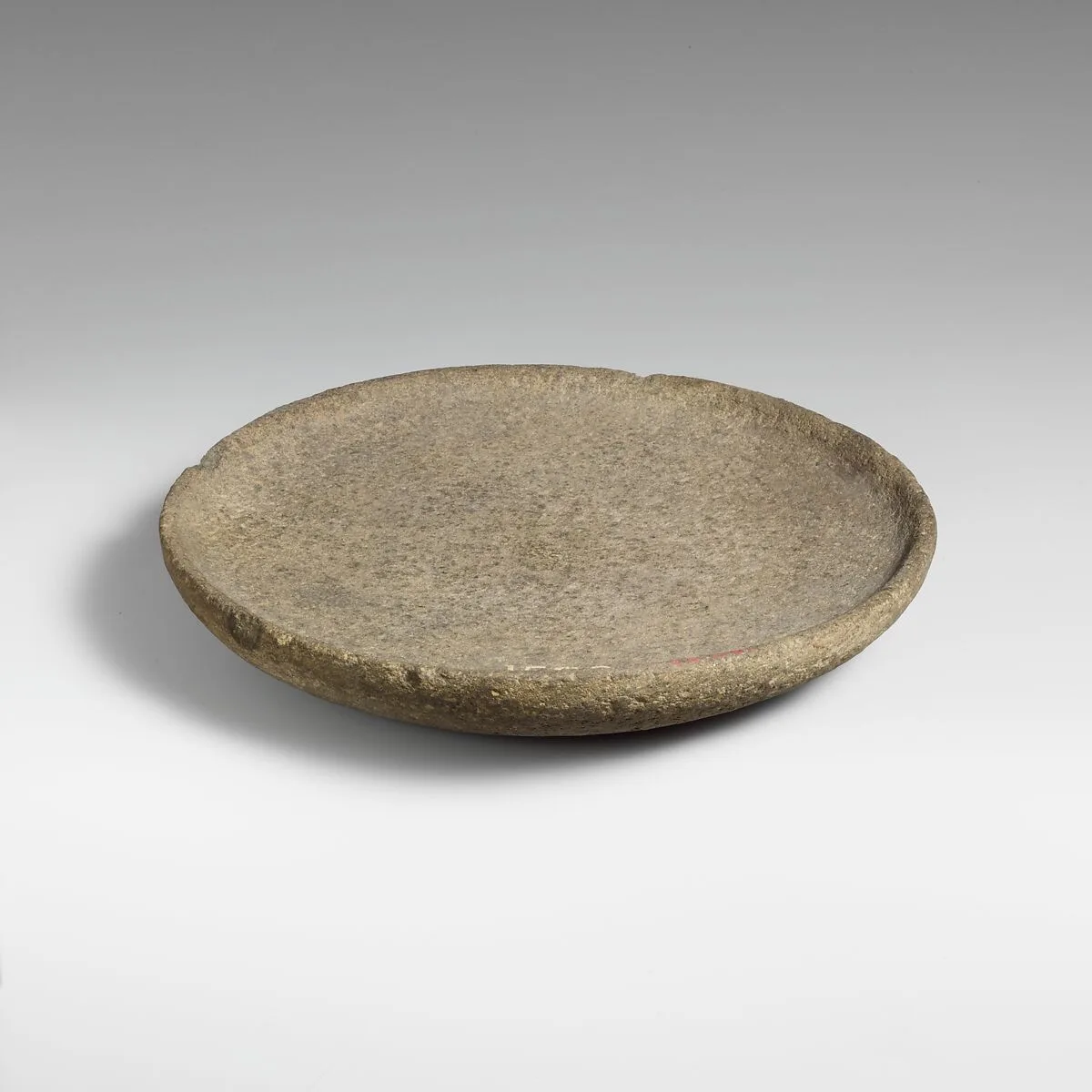 Basalt mortar or plate — Unknown