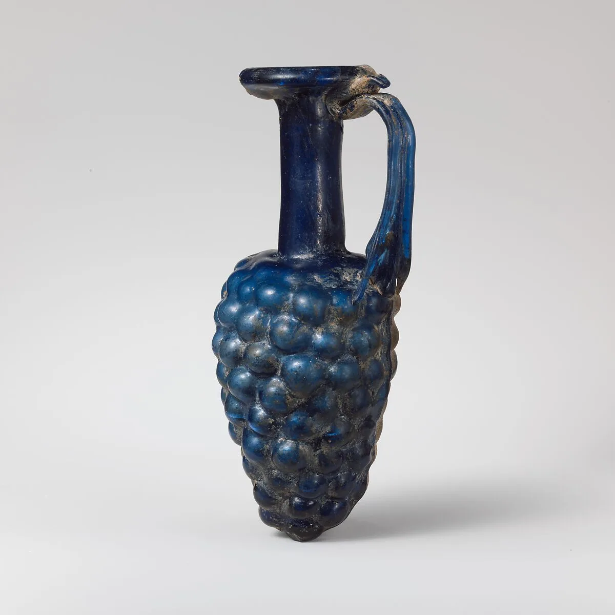 Glass jug in the shape of a bunch of grapes — Unknown