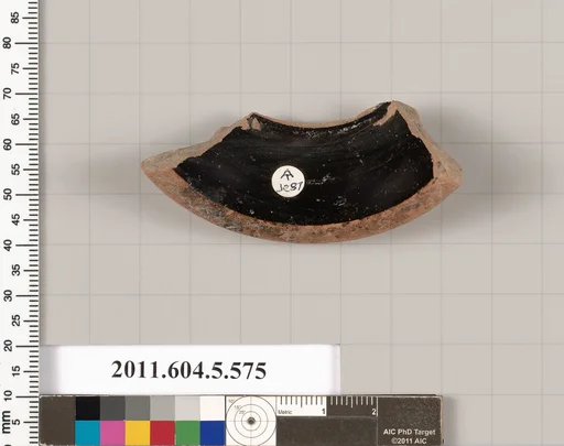 Terracotta fragment of a stemless kylix (drinking cup)