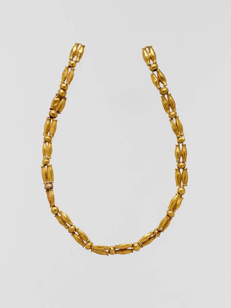 Gold beads, perhaps from a necklace — Unknown