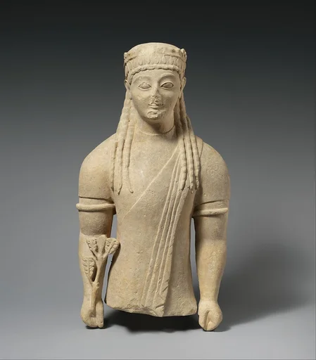 Limestone statue of a beardless male votary with a wreath of leaves