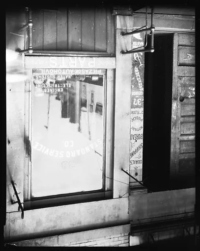 [Waterfront Doorway and Window of Standard Service Co. Engine Parts Store, New York City]