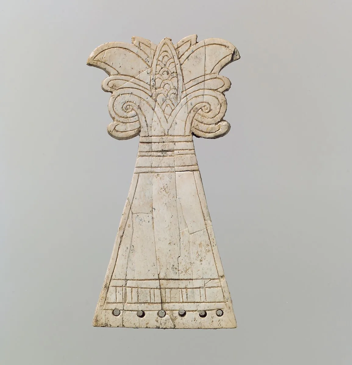 Incised horse frontlet carved into the shape of a flowering, volute palmette tree — Unknown