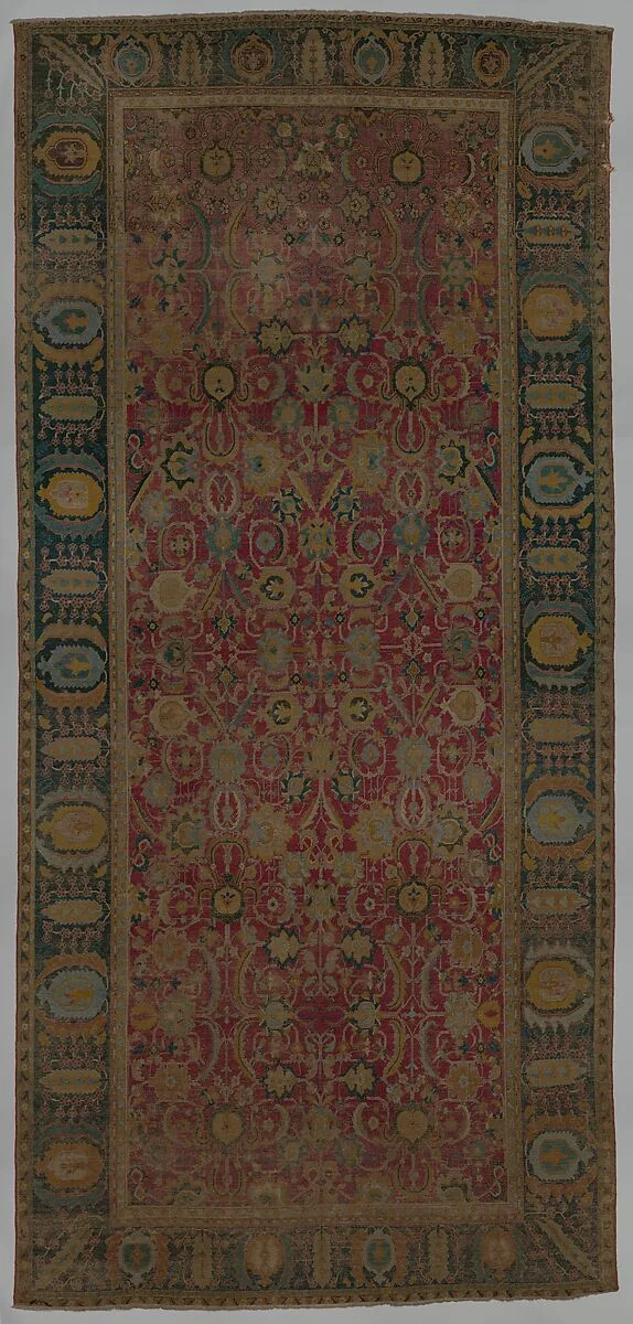 Indo-Persian carpet with repeat pattern of vine scrolls and palmettes — Unknown