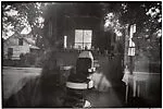 Barber Shop through Screen Door—McClellanville, South Carolina — Robert Frank