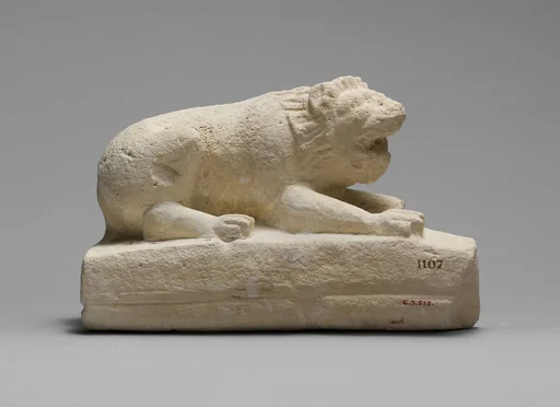 Limestone statuette of a lion