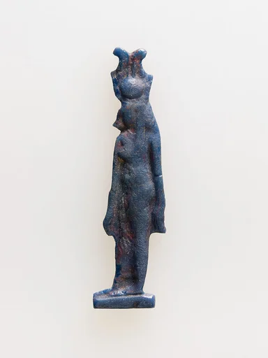 Amulet of cow-headed goddess with feathers atop disk and horns
