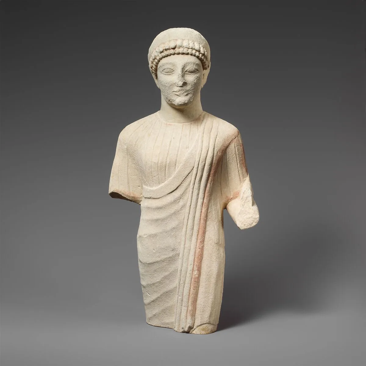 Limestone statuette of a beardless male votary with a diadem — Unknown