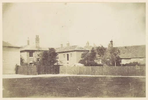 [Compound of Buildings Surrounded by Fence]