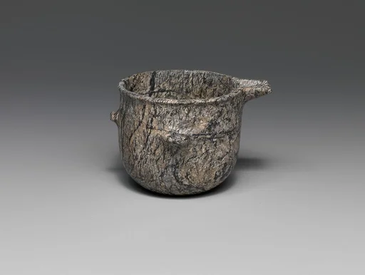 Steatite vase with spout and lugs