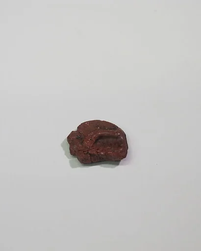 Mold-pressed amulet or fragment