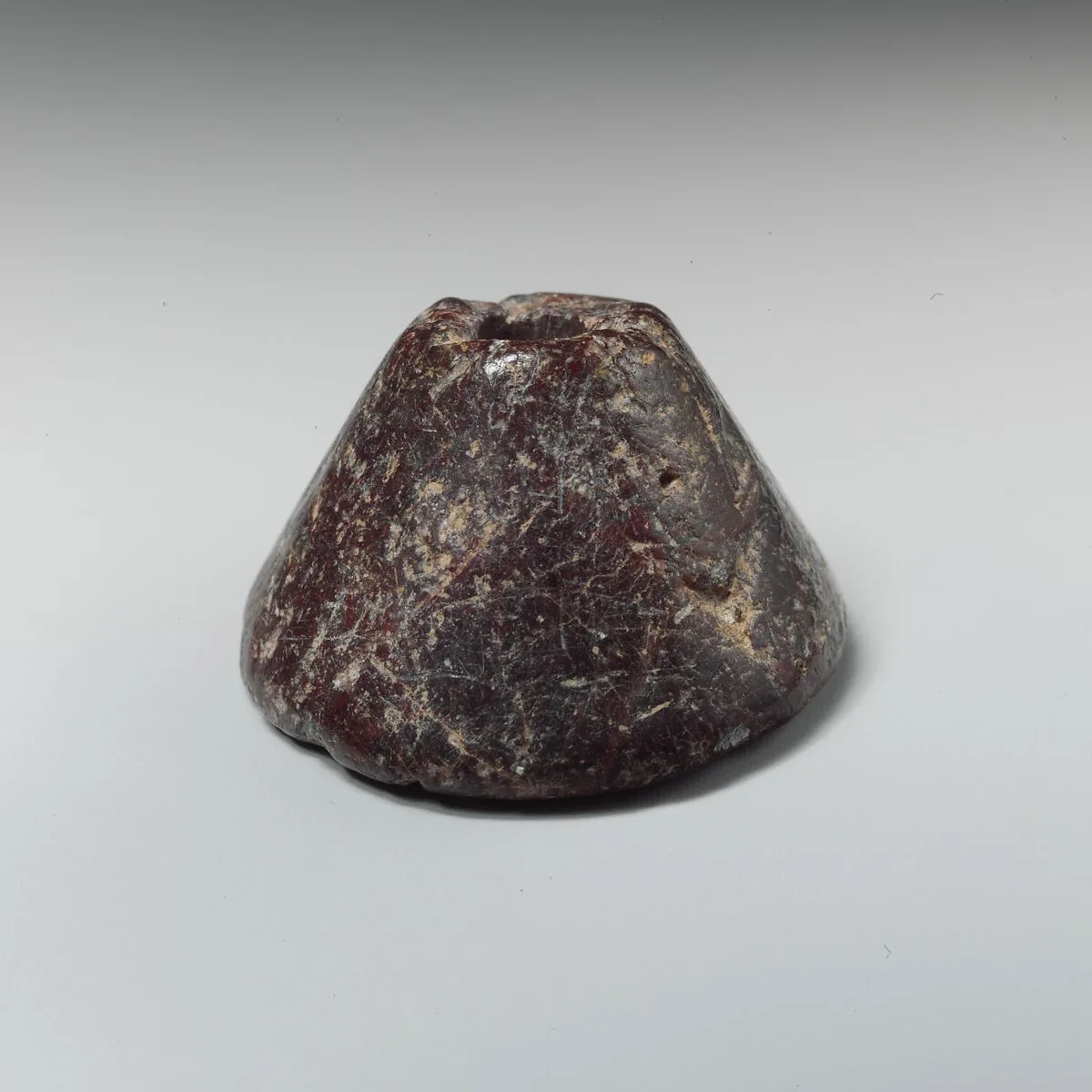 Stone spindle whorl — Unknown
