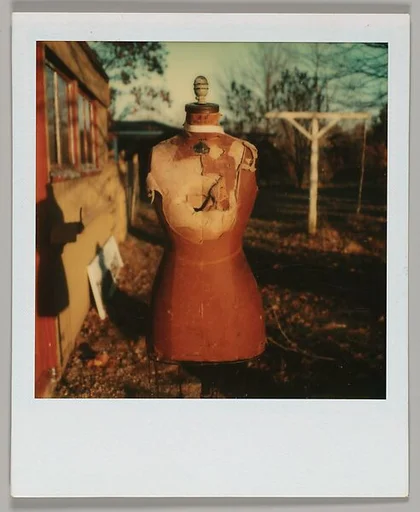 [Headless Mannequin in Yard]