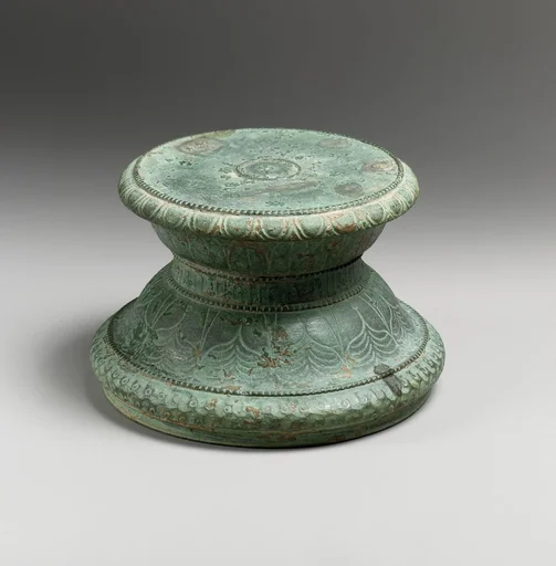 Base with floral decoration