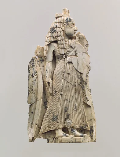 Furniture plaque carved in relief with a female figure