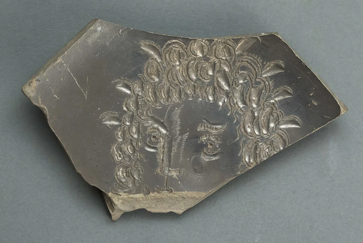 Plate with face, fragmentary — Unknown