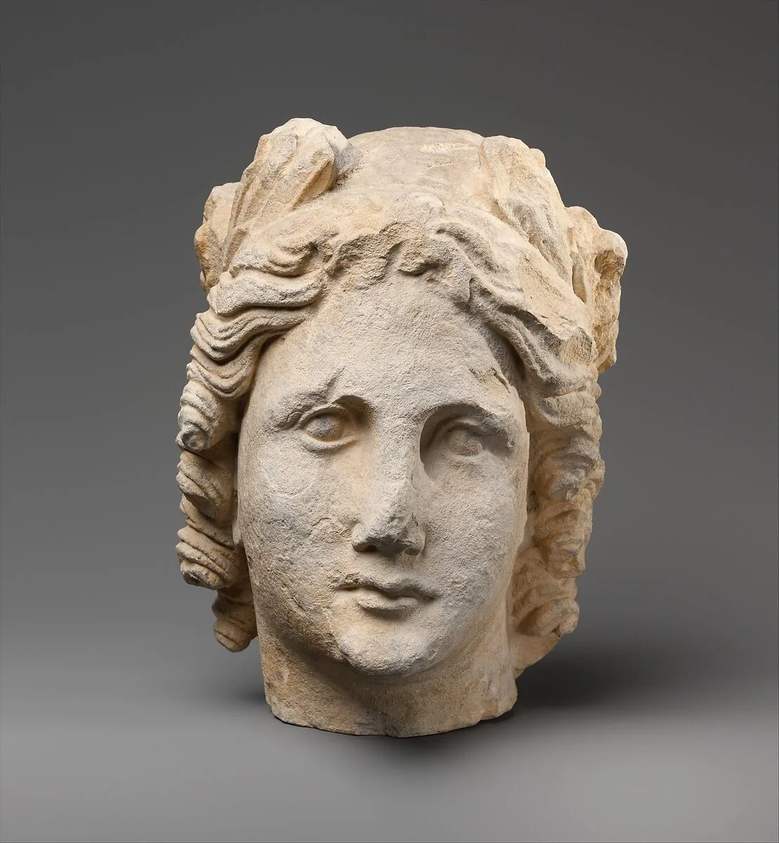 Limestone head of Apollo — Unknown