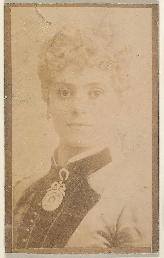 Portrait of actress wearing large brooch, from the Actresses series (N668) — Unknown