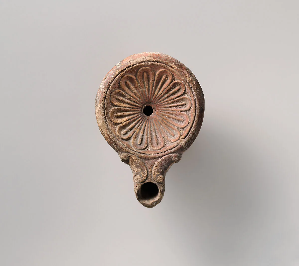 Tarracotta oil lamp — Unknown