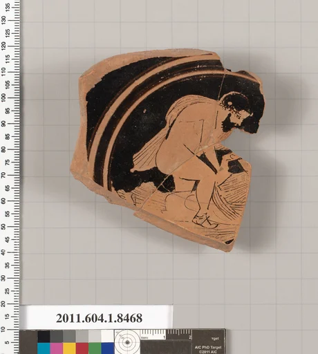 Terracotta fragment of a stemless kylix (drinking cup)