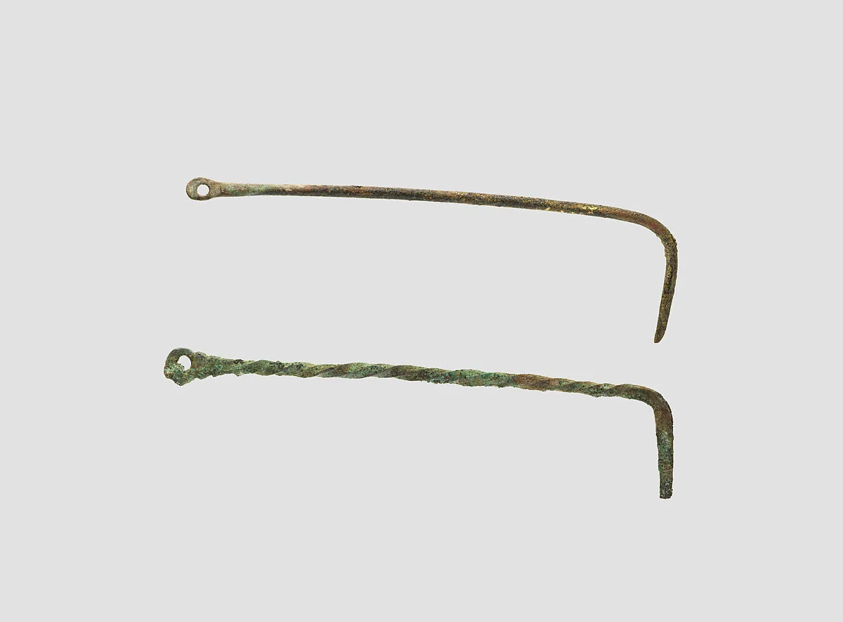 Cosmetic scraper pendants — Unknown