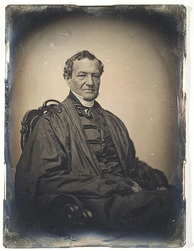 [Man in Judge's Robes; Seated]