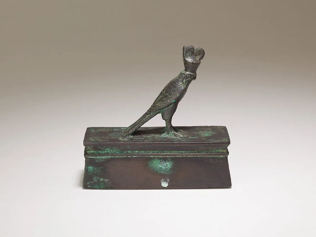 Falcon in double crown surmounting a shrine form box for an animal mummy — Unknown