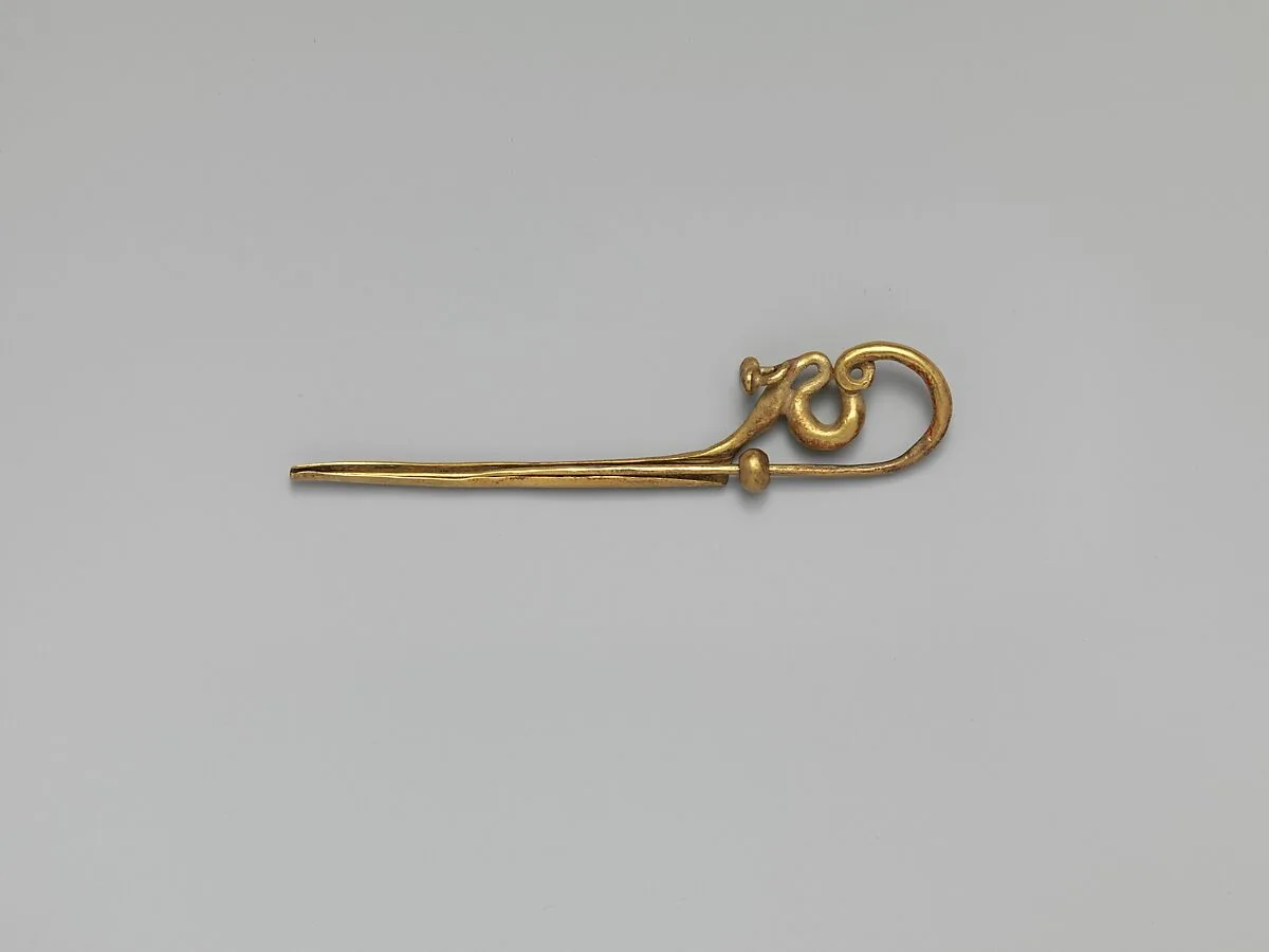 Gold serpentine fibula (safety pin) — Unknown