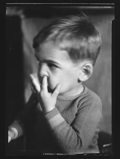 [Unidentified Child Picking Nose]