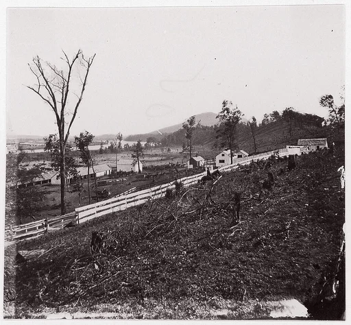 [White picket fence with buildings in background].  Brady album, p. 123