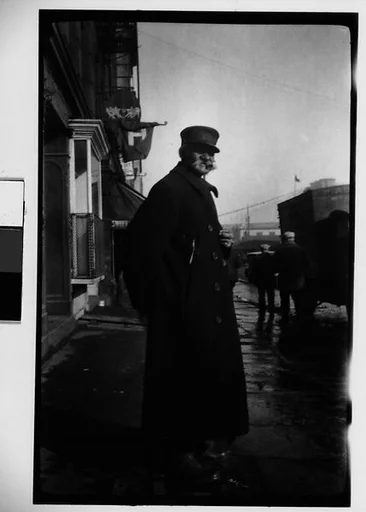 [Man in Squared Hat and Overcoat on Sidewalk, New York City]