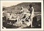[Lucien Jacques, Walker Evans, and Georgette Maury Leaning on Stone Wall with Wine Bottle and Glasses, Provence, France]
