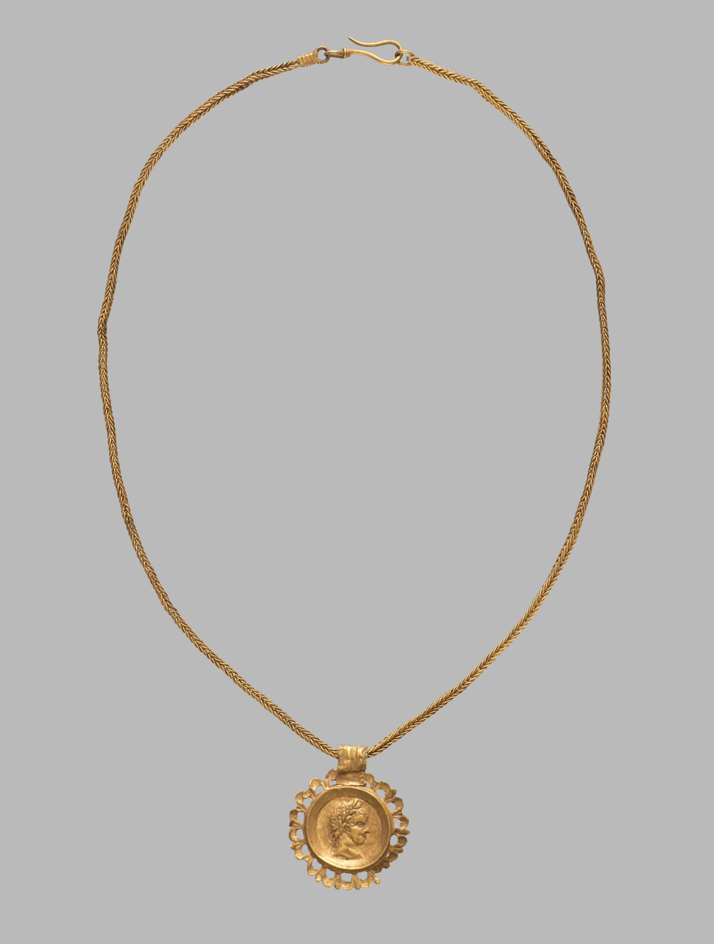 Chain with a pendant bearing an emperor's profile in an openwork frame — Unknown