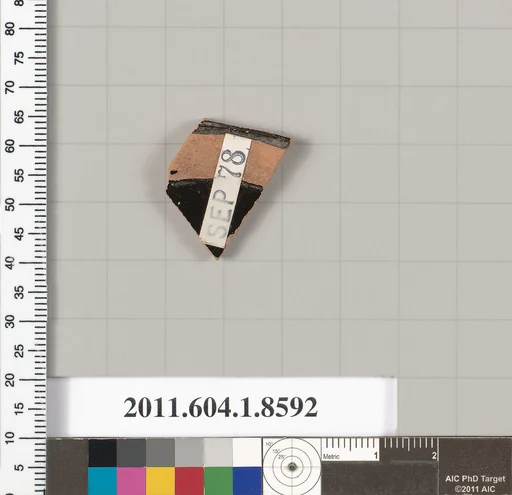 Terracotta fragment of a stemless kylix (drinking cup)