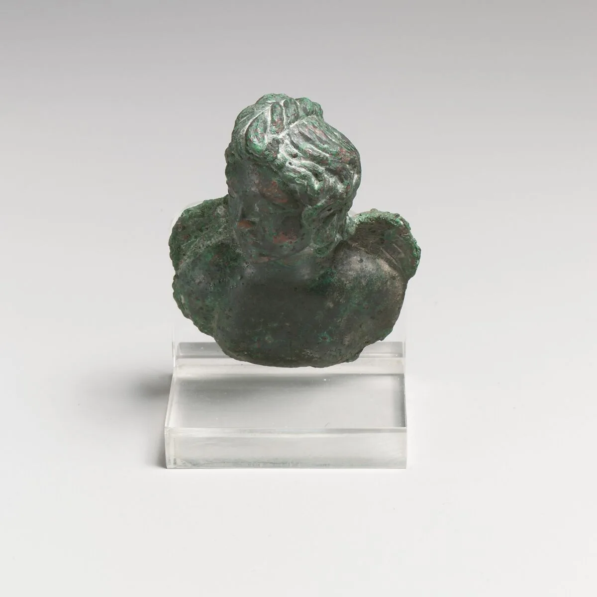Bronze fulcrum attachment with a bust of Eros — Unknown