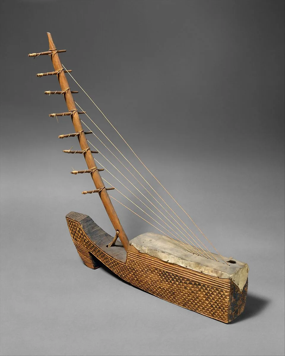 Ngombi (arched Harp) — Unknown