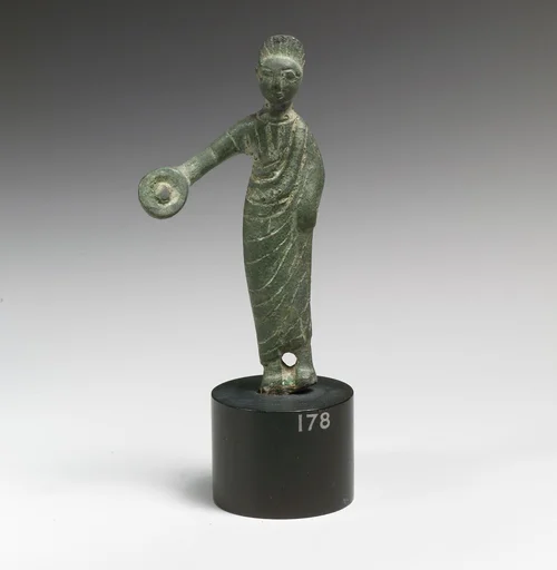 Statuette of a woman holding a phiale (libation vessel)