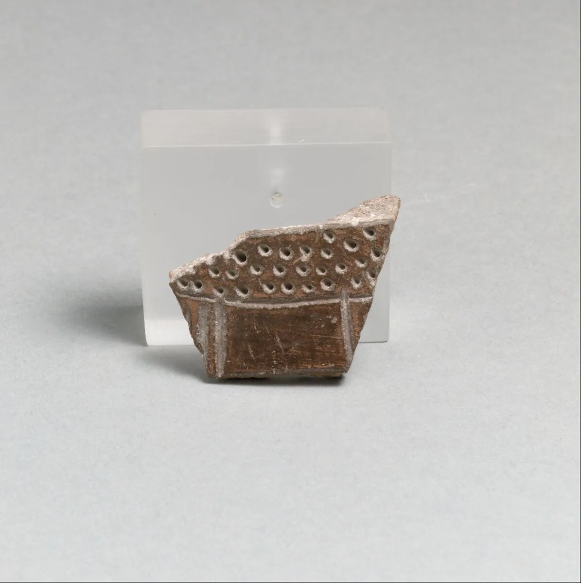 Terracotta vessel fragment with incised lines and punctations — Unknown