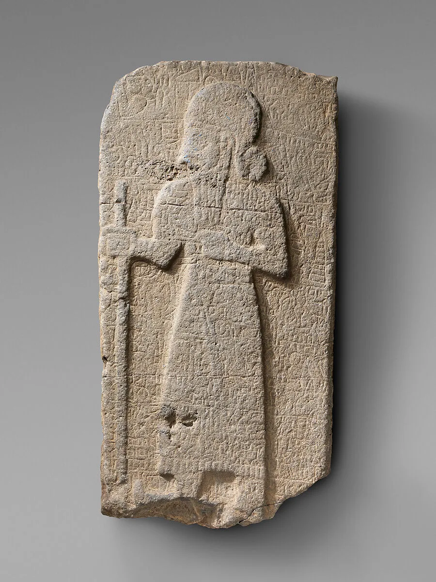 Relief: bearded figure holding staff; hieroglyphic inscription — Unknown