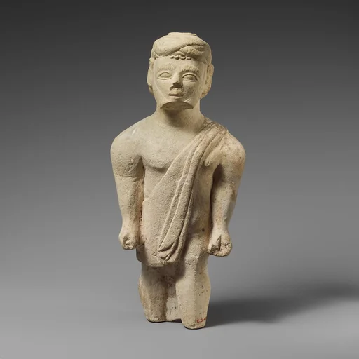 Limestone statuette of a bearded male votary in Greek dress